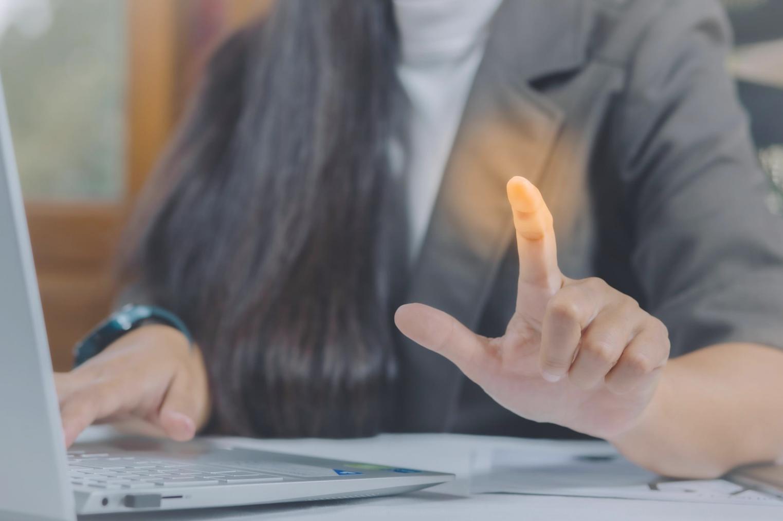 Students working on web design projects in a modern classroom setting